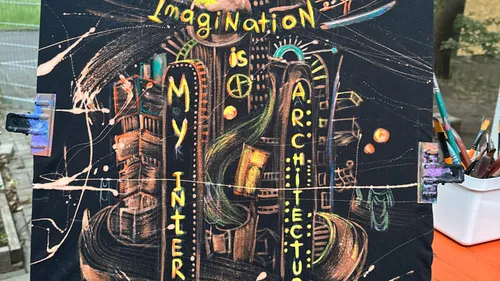 Colorful painting with text and abstract buildings.