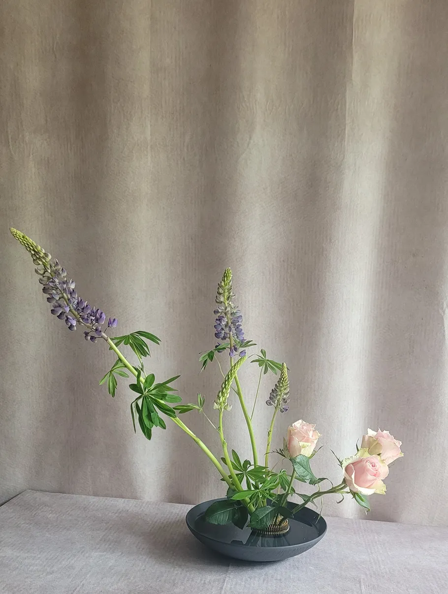 Ikebana flowers arranged in minimalist style.