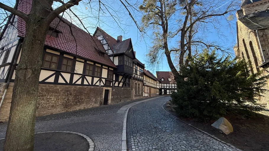 Half-timbered houses along a cobblestone street.