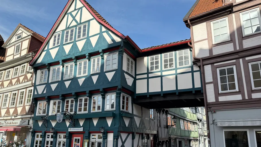 Timber-framed buildings connected by passageway.