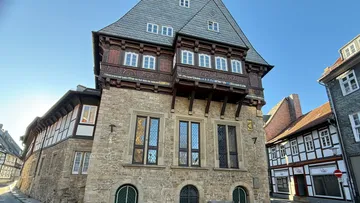 Historic timber-framed building on urban street.