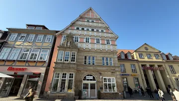 Historic building in city center, sunny day.