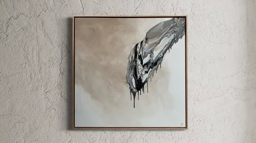 Abstract painting with metallic streaks on textured wall.