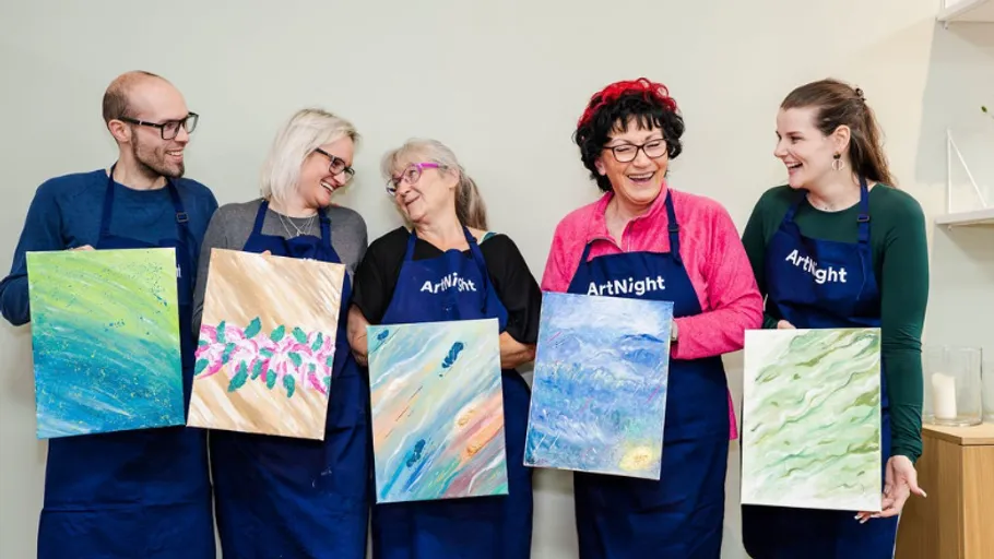 Five people holding their colorful paintings.