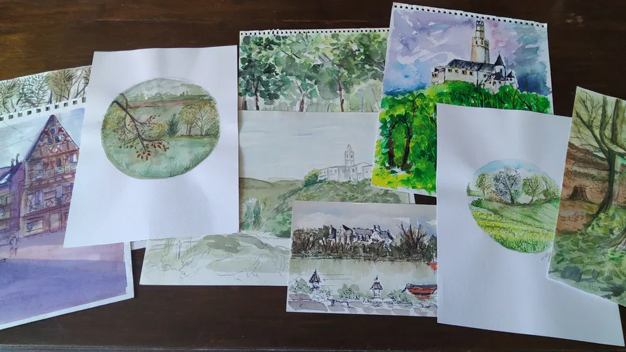 Various watercolor landscapes and buildings on paper.