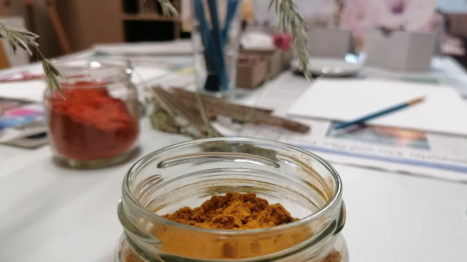 Jar of spices on craft table.