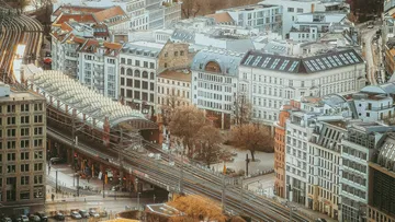 Railway tracks and urban buildings from above.