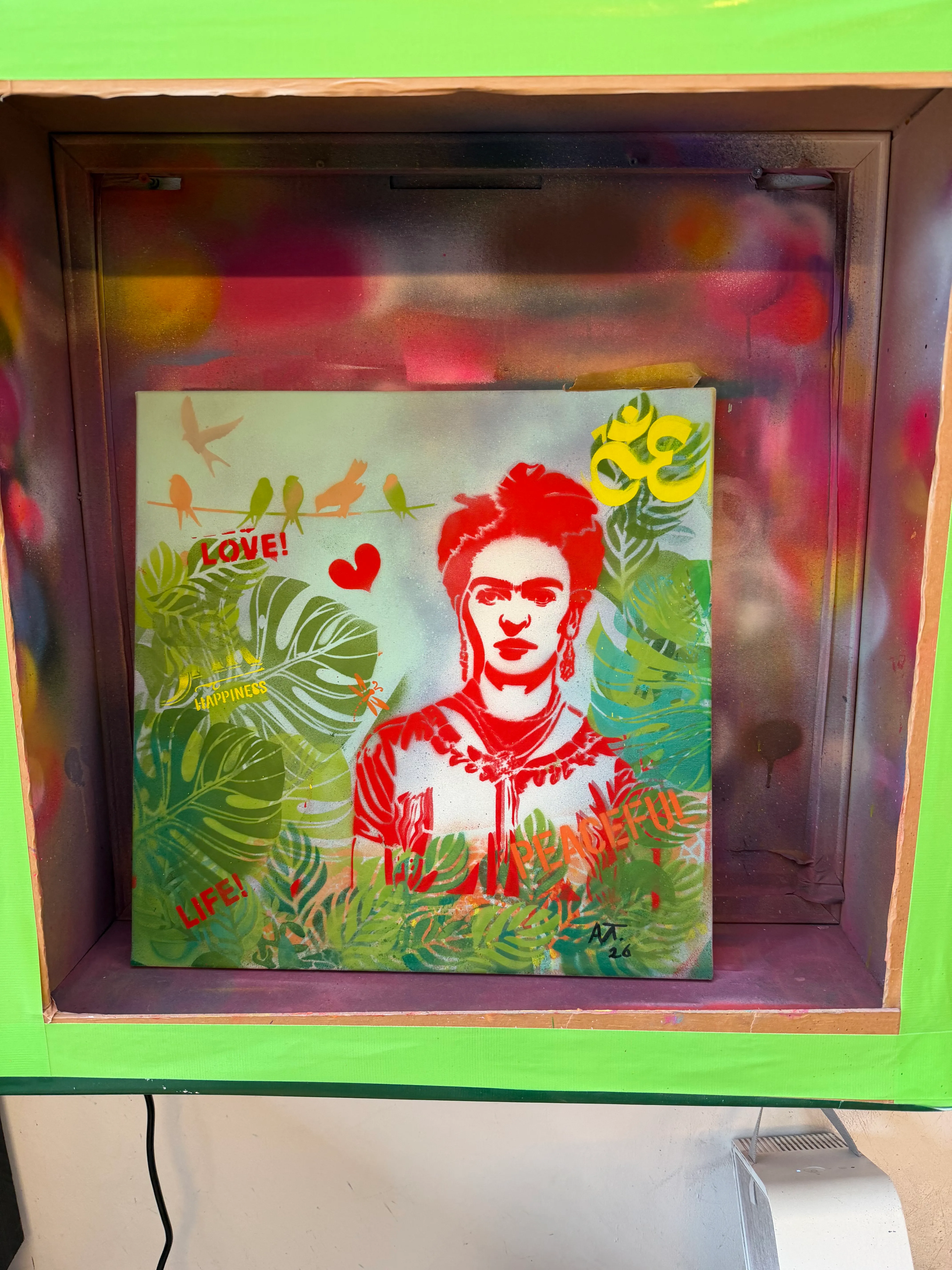 Painting of woman surrounded by leaves, vibrant colors.