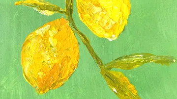 Two lemons on green background canvas.