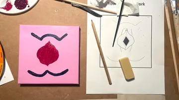 Canvas and tools on an artist's workspace.