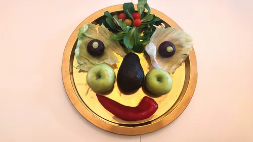 Food arranged as a face on a plate.