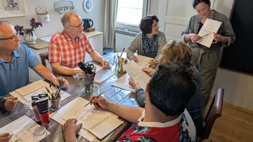 Group painting class in home setting.