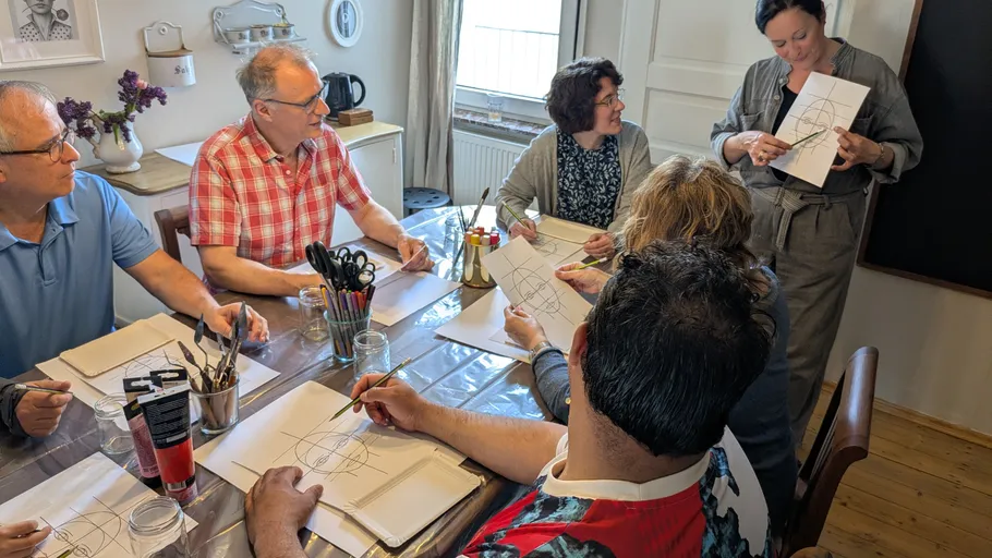 Group painting class in home setting.