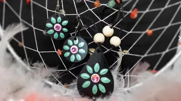 Jewelry displayed on dreamcatcher web.