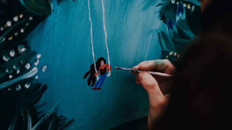 Hand painting figure on blue canvas.