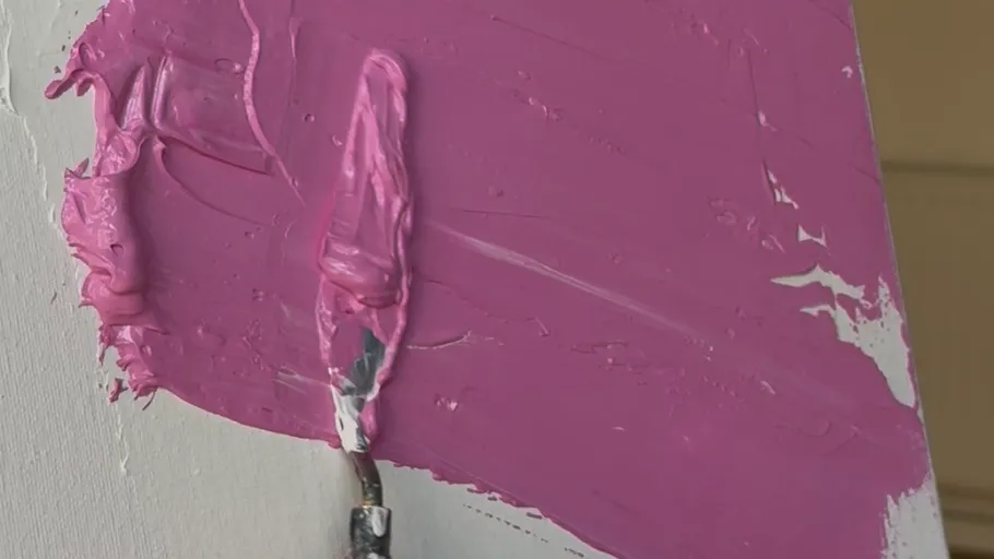 Paint spread on canvas with palette knife.