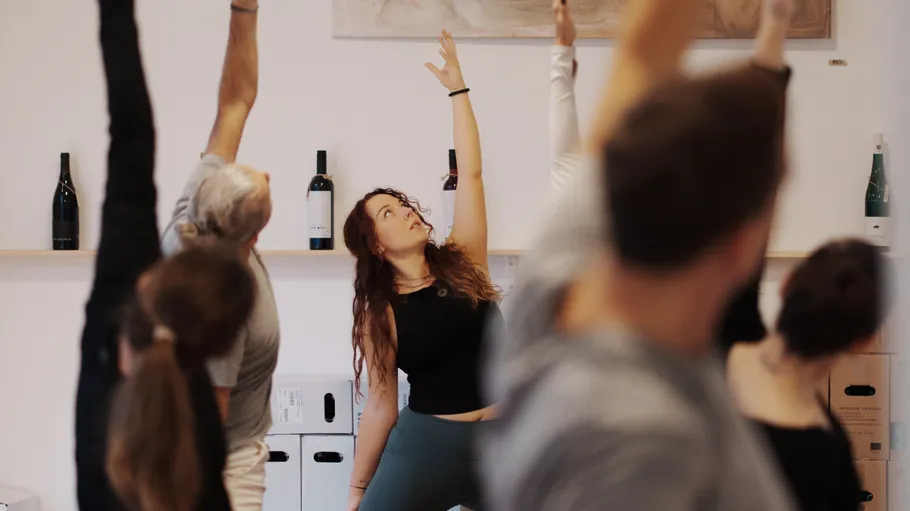 People practicing yoga in a room.