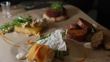Gourmet dish with various plated components.