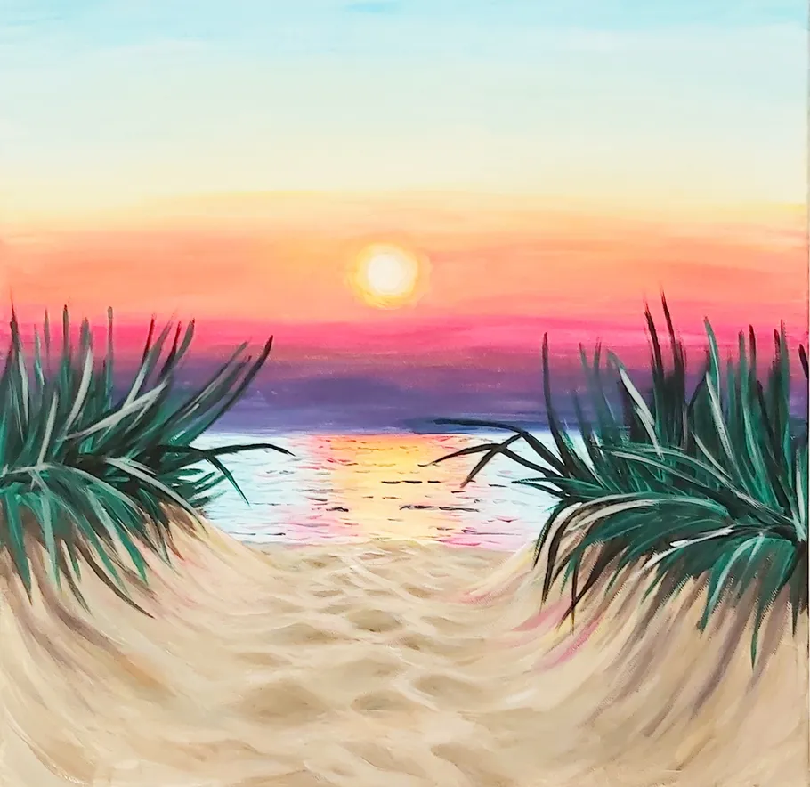 Sunset over ocean with sandy beach pathway.