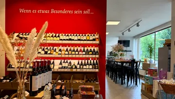 Wine display in a cozy shop setting.