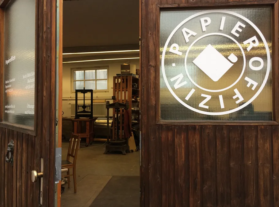 Open wooden door to printing workshop.