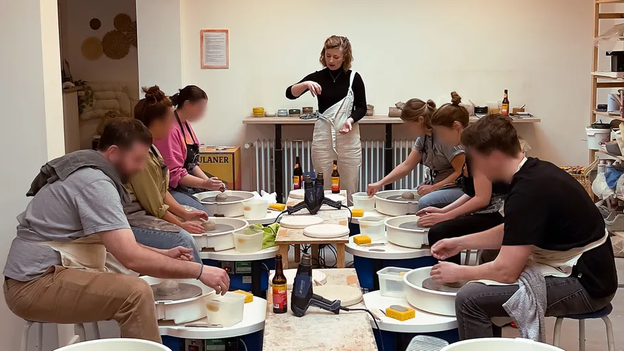 People learn pottery in a studio.