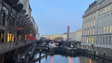Canal between modern buildings in city.