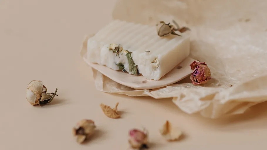 Soap with dried flowers on paper.