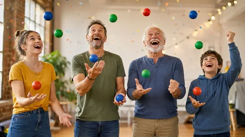 Four people juggling balls indoors