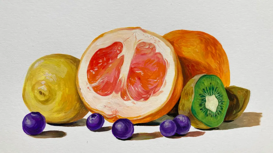 Fruits arranged on a plain table.