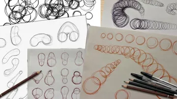 Pencil drawings of circular shapes on paper.