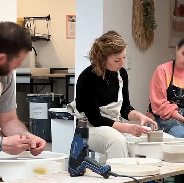 People crafting pottery in a studio