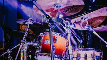 Drum set with cymbals on stage.