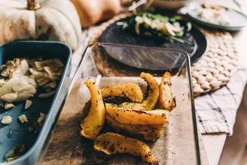 Roasted squash slices on dining table.