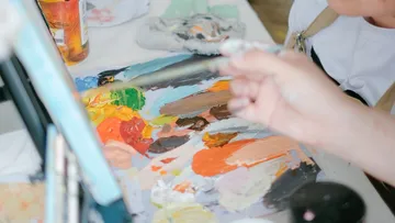 Hand painting with brush on canvas