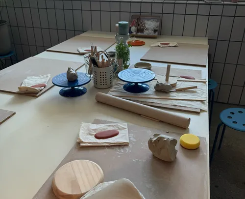 Clay setup on table in pottery studio.