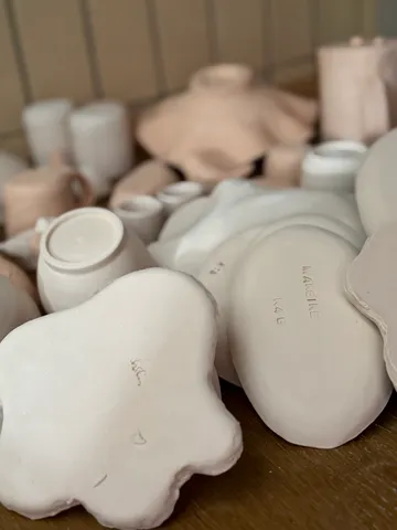 Ceramic pieces on a wooden table.