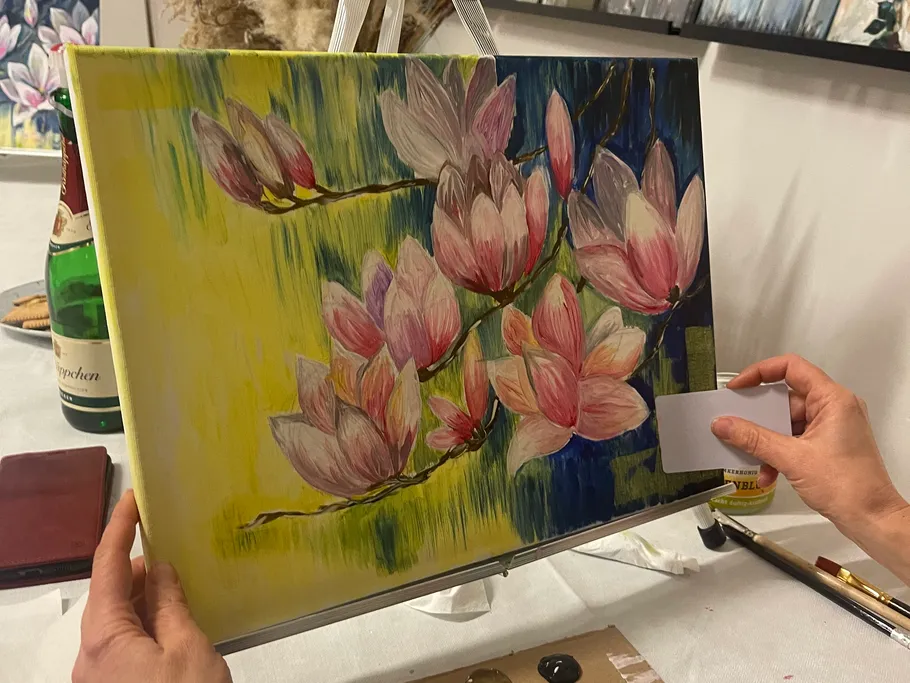 Paintings of magnolia blossoms are viewed and edited.