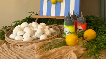 White eggs and paint with lemons.