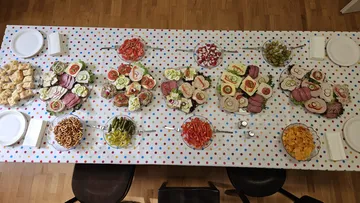 Buffet table with assorted finger foods.