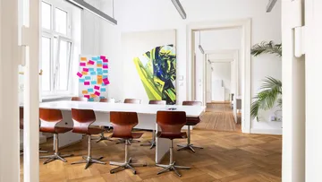 Meeting room with chairs around a table.