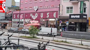 Street with colorful buildings and shops.