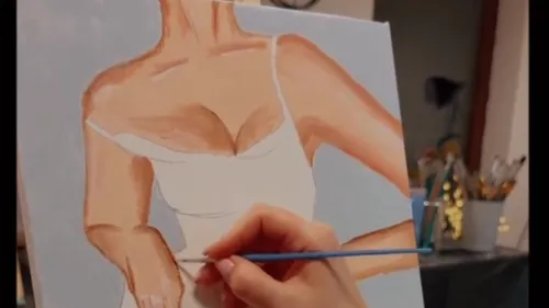 Hand painting female figure on canvas.