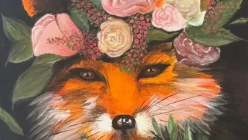 Fox with flower crown on head.
