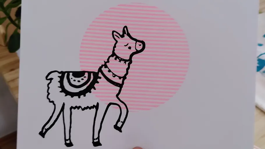 Cartoon llama prancing, pink circle background.
