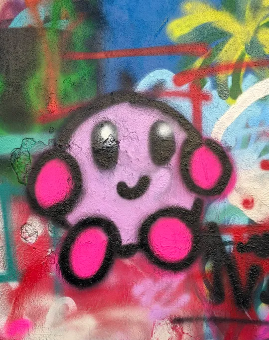 Cartoon-Graffiti auf bunter Wand.