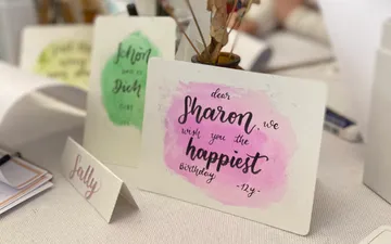 Birthday card and place card on table.