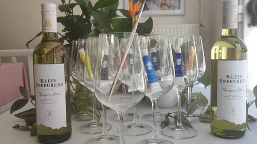 Wine bottles with glasses and brushes.