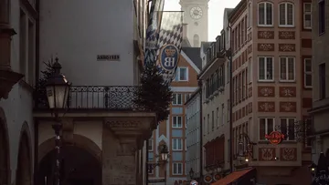 Narrow urban street with historical architecture.