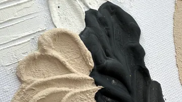 Strukturierte schwarze und beige Farbe auf Leinwand